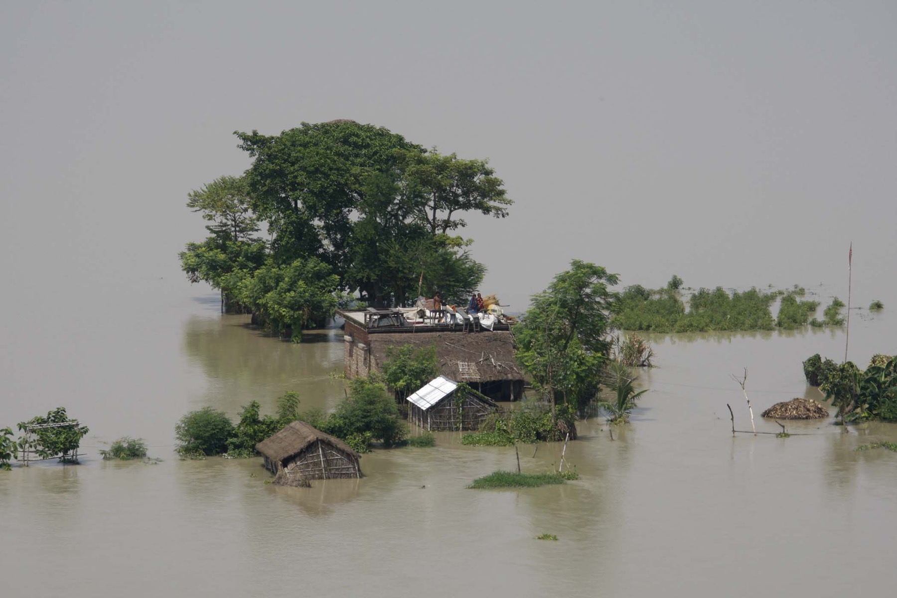 Houses standing in floodwater